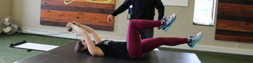 woman completing physical therapy with physical therapist